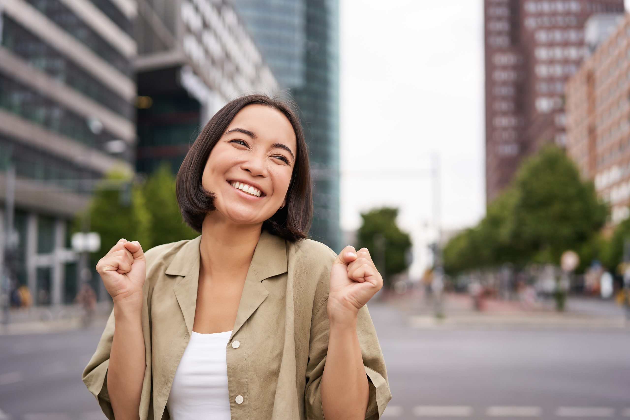 happy asian girl triumphing on streets of city da 2022 11 17 16 29 25 utc scaled - Mastering Tough Interview Questions: Your Path to Confidence and Career Success